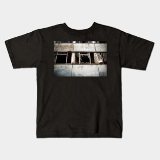 Broken windows of a derelict modern building in East Berlin. Kids T-Shirt